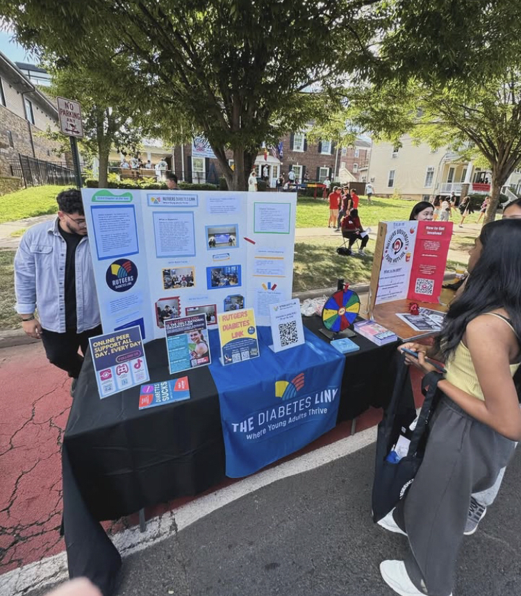 The Rutgers Diabetes Link stand at the 2024 Involvement fair, as an outdoor booth with diabetes information and a large display board